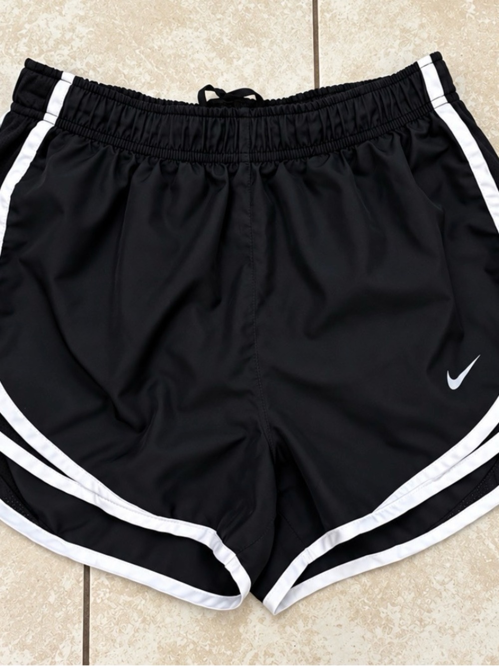 Nike Black Athletic Shorts with White Trim and Swoosh